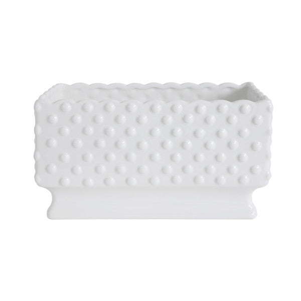 A white ceramic planter with a hobnail texture, scalloped edge, and polka dots.